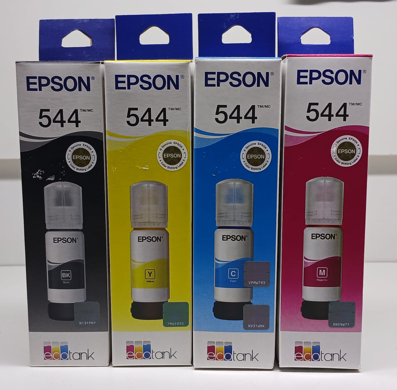 Embalagens de tintas Epson 544 nas cores preto, ciano, magenta e amarelo